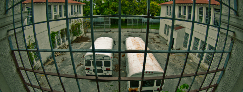 Two busses at a penitentiary